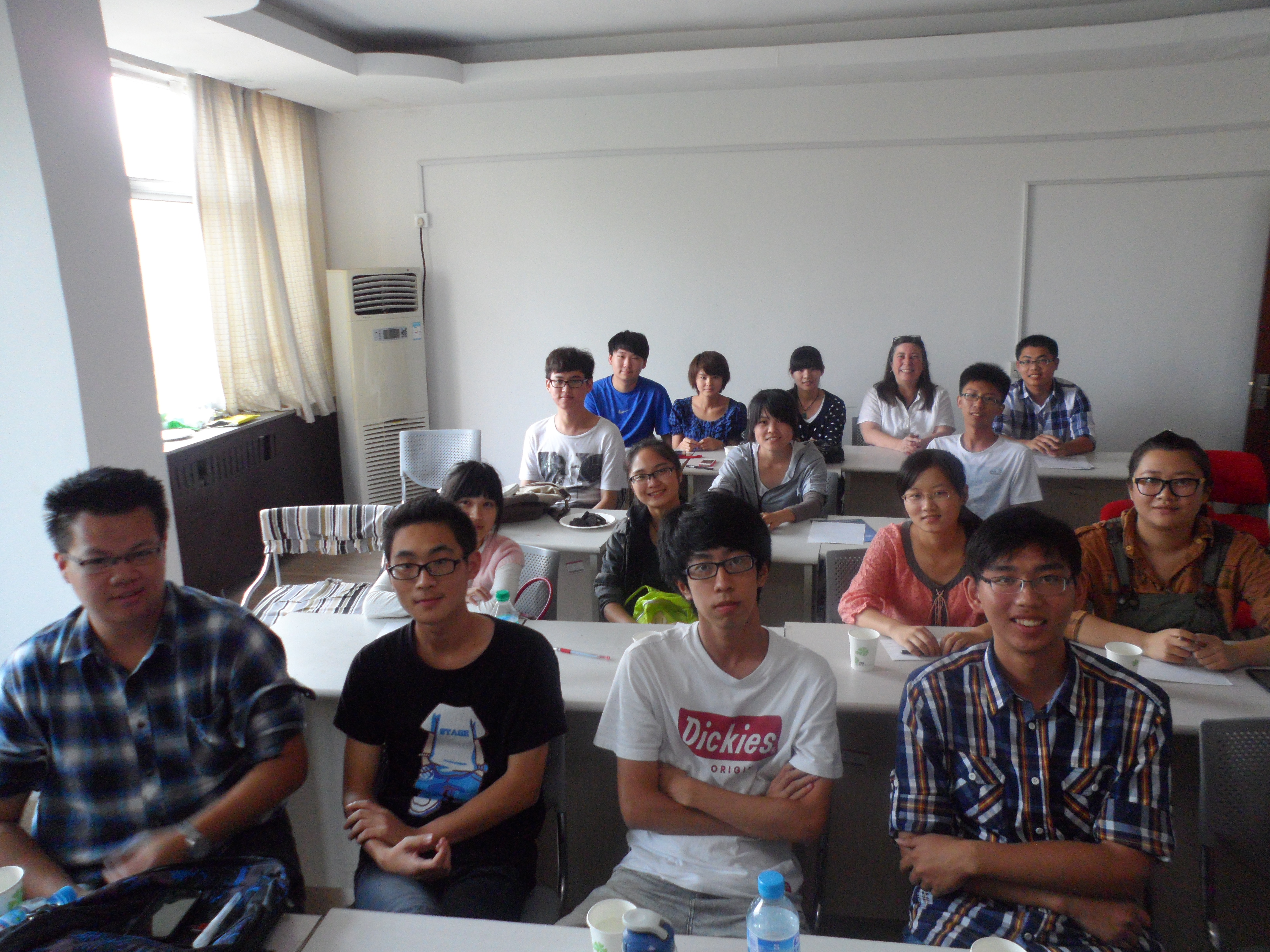 Janet sitting at back of classroom with students